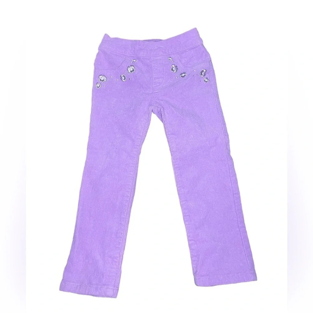 Purple velvet pants with floral detailing